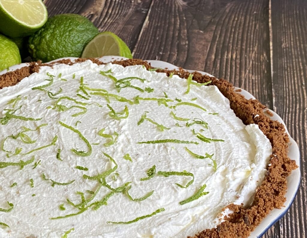 508E0DC7 0C06 47C2 A4DA 32307170ED38 1024x794 - Boozy Deep Dish Coconut Margarita Key Lime Pie with Tequila Blanco & Coconut Rum