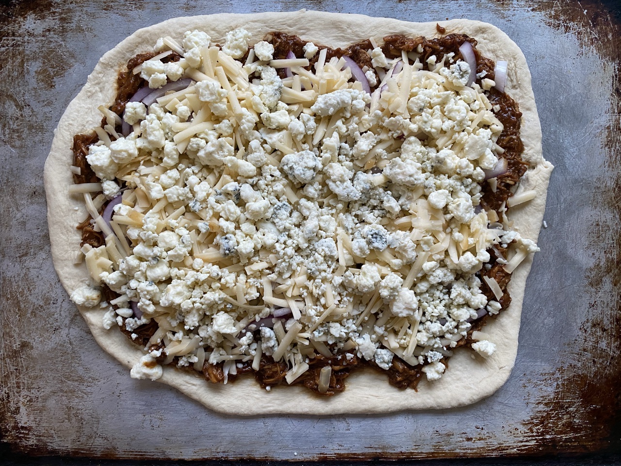 9B13A688 7459 4C40 8CC5 4BD8F8551023 - BBQ Chicken Pizza with Red Onions, Gorgonzola, & Smoked Gouda