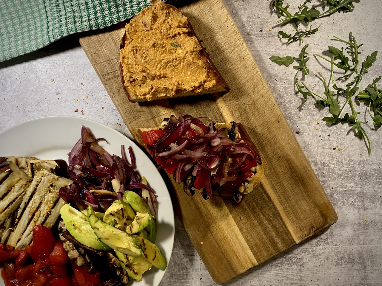 mediterranean grilled vegetable sandwich on a cutting board
