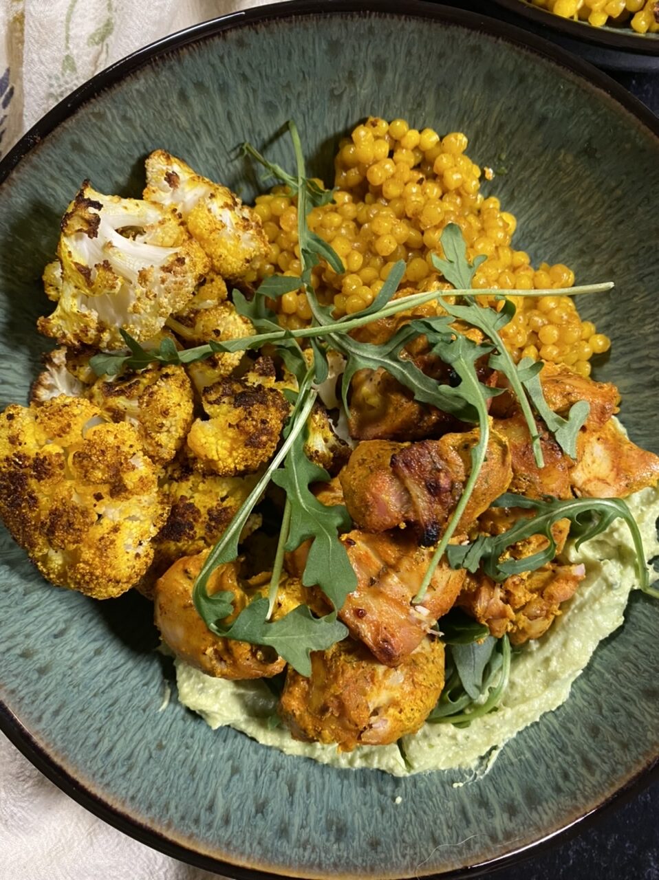 D623D737 D8F2 4025 A142 E8F40538CEC7 e1612734970472 - Moroccan-Style Chicken “Shawarma” with Golden Cauliflower, Turmeric Pearl Couscous, & Whipped Avocado Feta