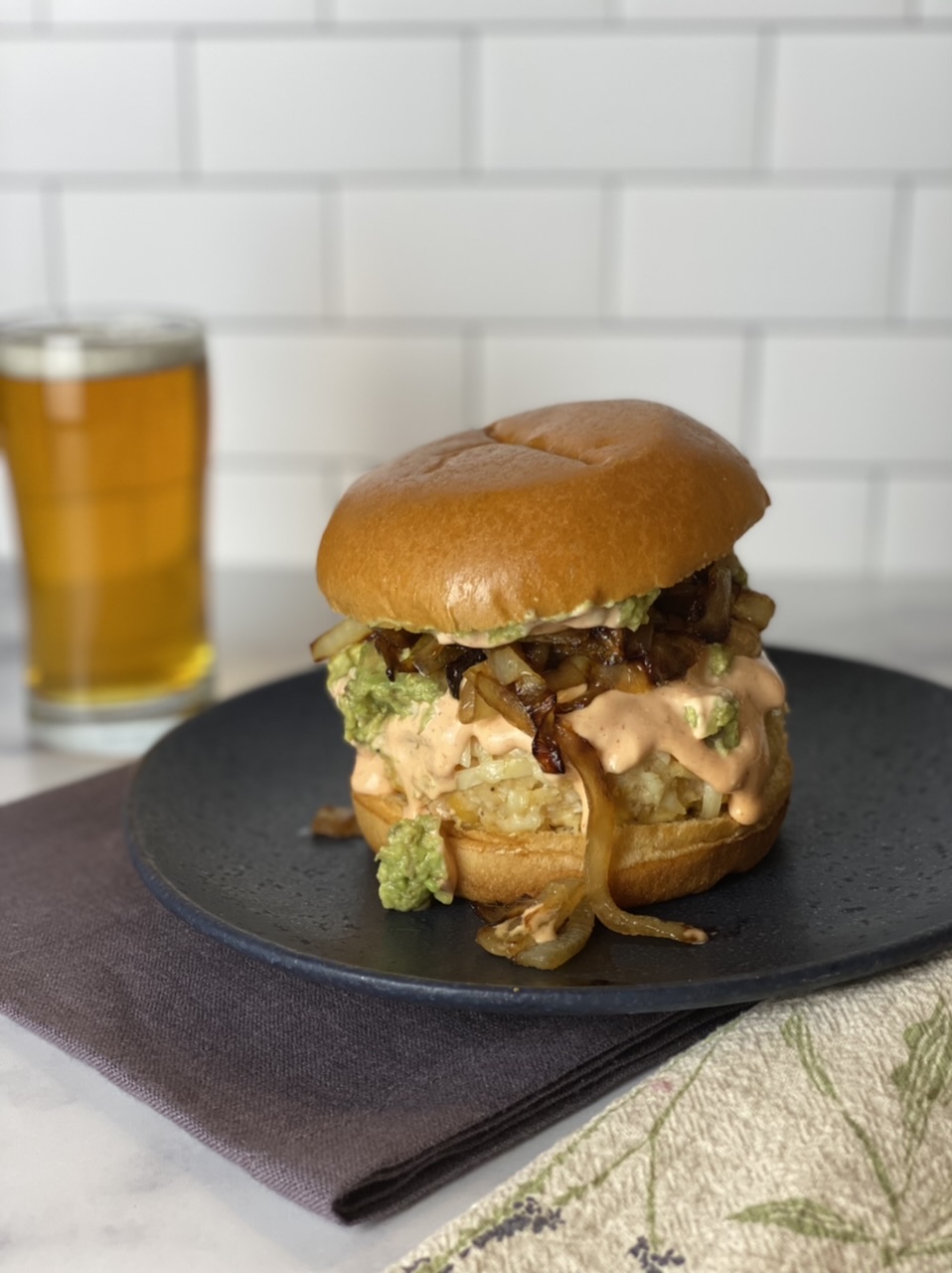 E96F7BC6 C028 4F67 9458 173E47810FE3 - Smashed Avocado White Bean Burgers with Caramelized Onions