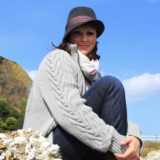 Carolyn Rauffer sitting on a rock in Ireland