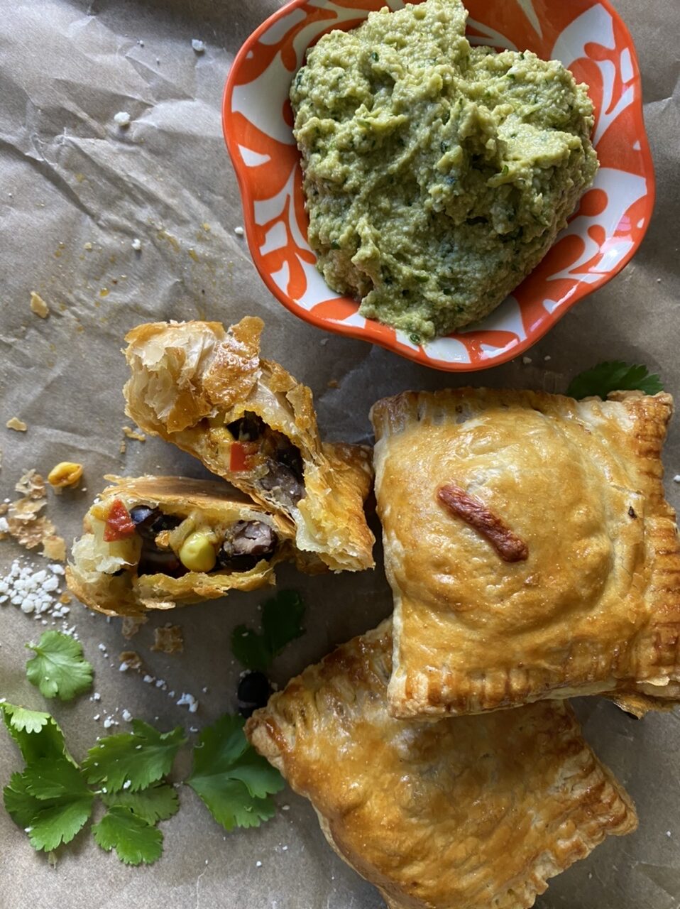 39167905 9DFC 41BD 891D 228A96C4691E e1618070758240 - Vegetarian Mexican Hand Pies with Avocado Crema