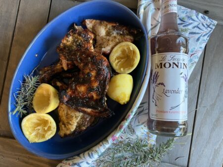 Lavender chicken with lemons in a blue serving dish