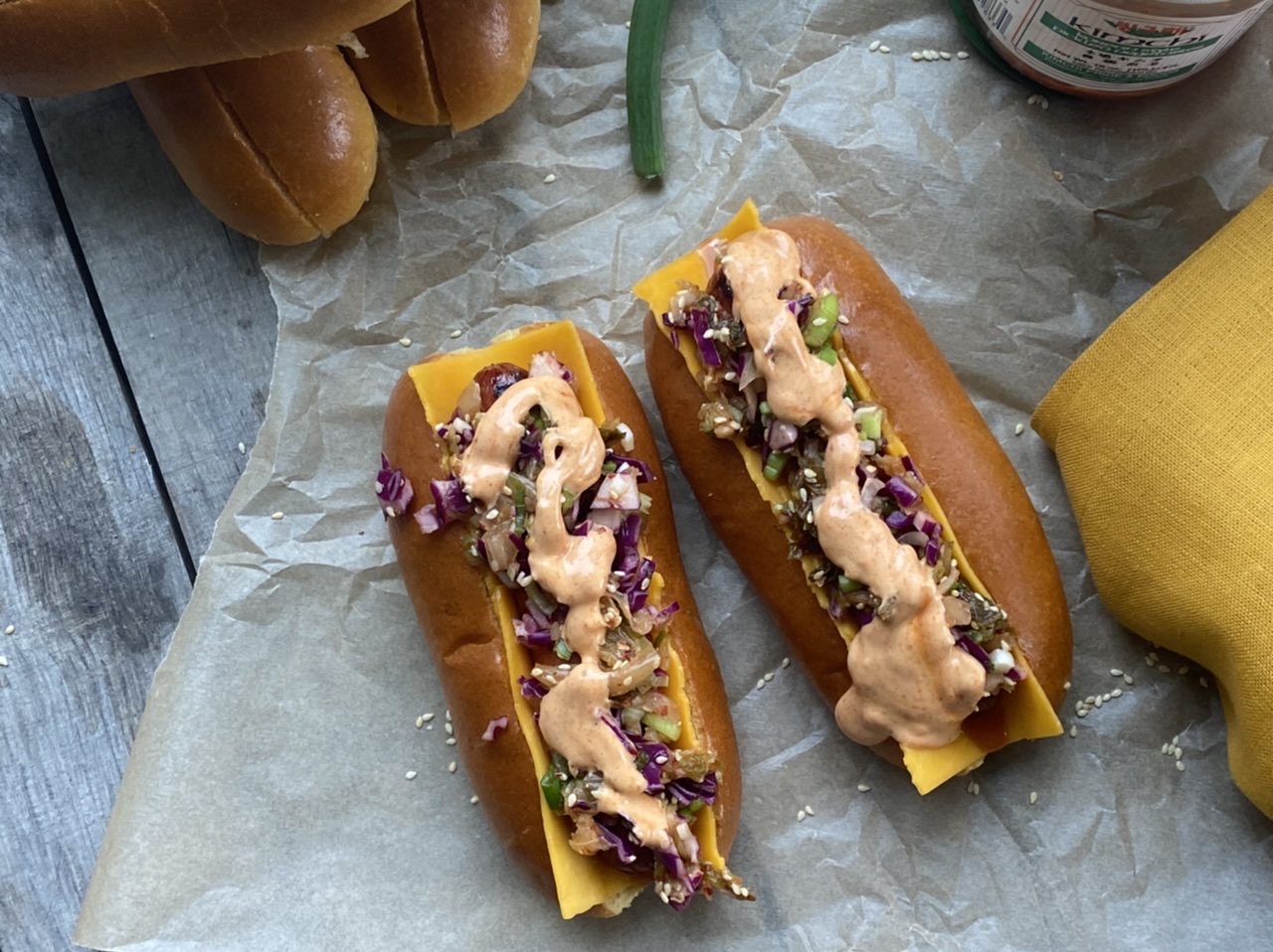 14DC1227 56C4 4F38 9E35 1D52ACBAE369 - Cheesy Korean-Style Hot Dogs with Kimchi Slaw & Gochujang Aioli