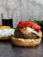 D917C573 3A56 4E36 ABD8 07990D75C624 e1623942210906 150x200 - Mediterranean Burgers with Fried Halloumi, Roasted Red Peppers, Tzatziki, & Garlic Hummus with a Cilantro Goat Cheese Spread